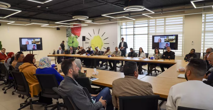a group of people in a meeting
